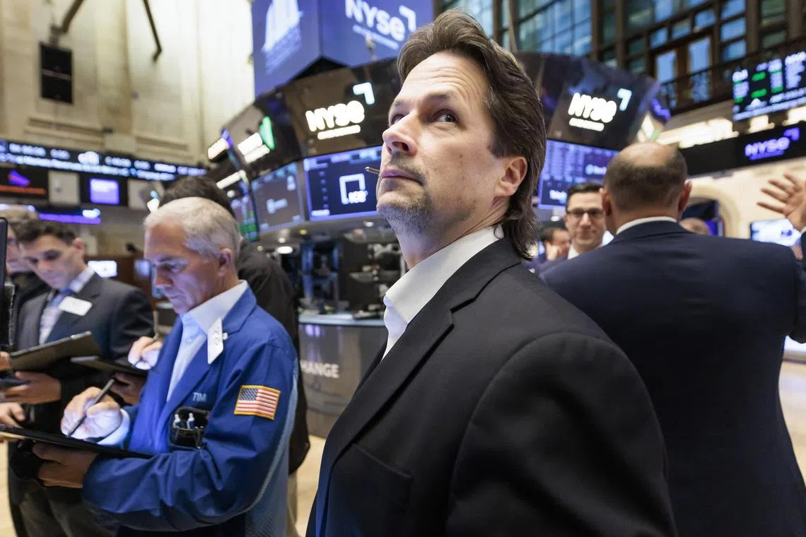 Traders work on the floor of the New York Stock Exchange, on Jan 13, 2023.