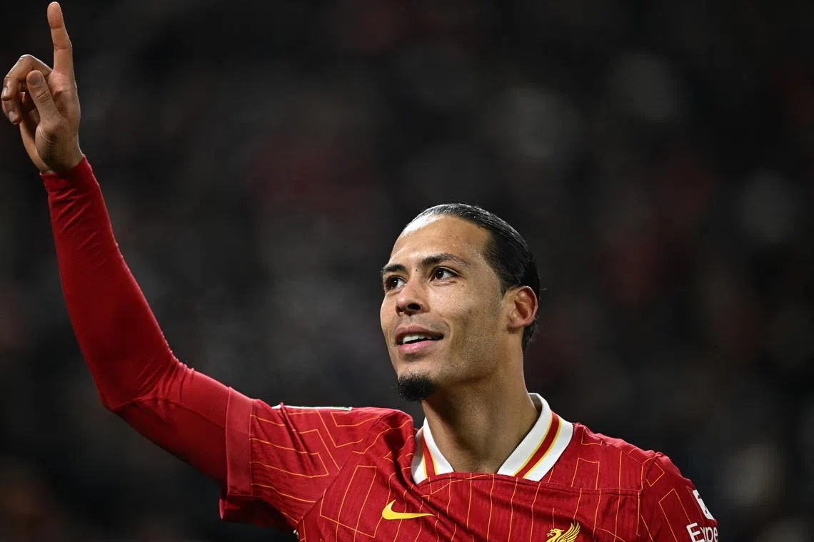 FILE PHOTO: Soccer Football - Carabao Cup - Semi Final - Second Leg - Liverpool v Tottenham Hotspur - Anfield, Liverpool, Britain - February 6, 2025 Liverpool's Virgil van Dijk celebrates scoring their fourth goal REUTERS/Dylan Martinez/File Photo