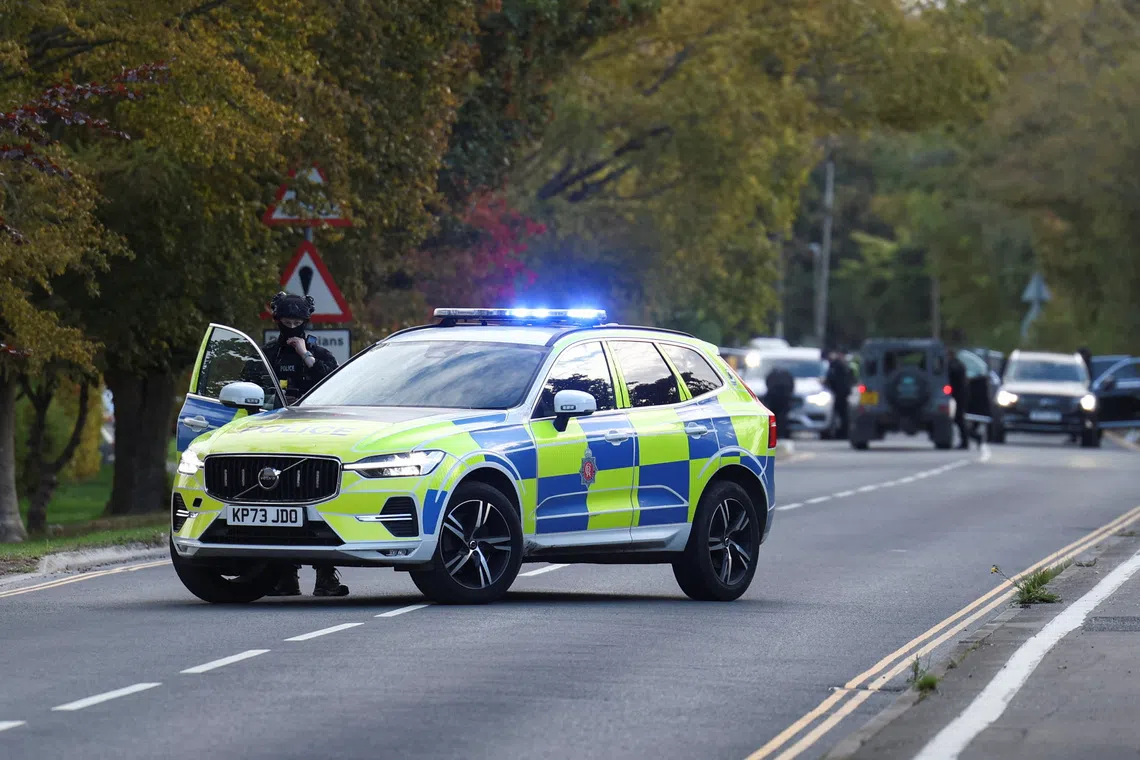 Police blocking a road near the US Fairford air base in south-west England on Sept 27.
