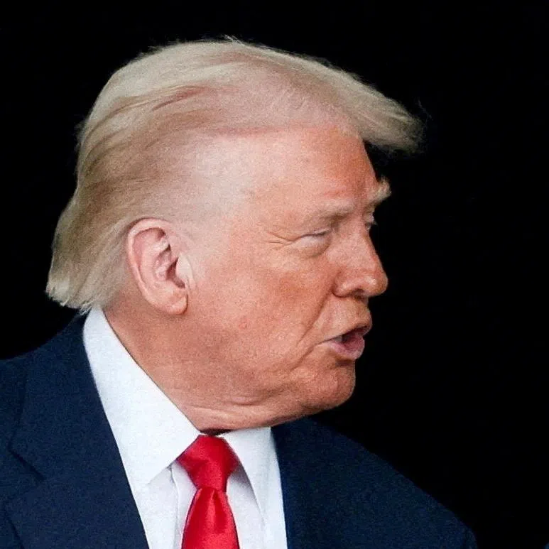 FILE PHOTO: President Donald Trump and Chinese President Xi Jinping talk as they leave after a bilateral meeting at Gimhae International Airport, on the sidelines of the Asia-Pacific Economic Cooperation (APEC) summit, in Busan, South Korea, October 30, 2025. REUTERS/Evelyn Hockstein//File Photo