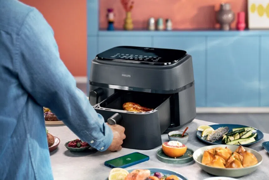 Man cooking using an airfryer