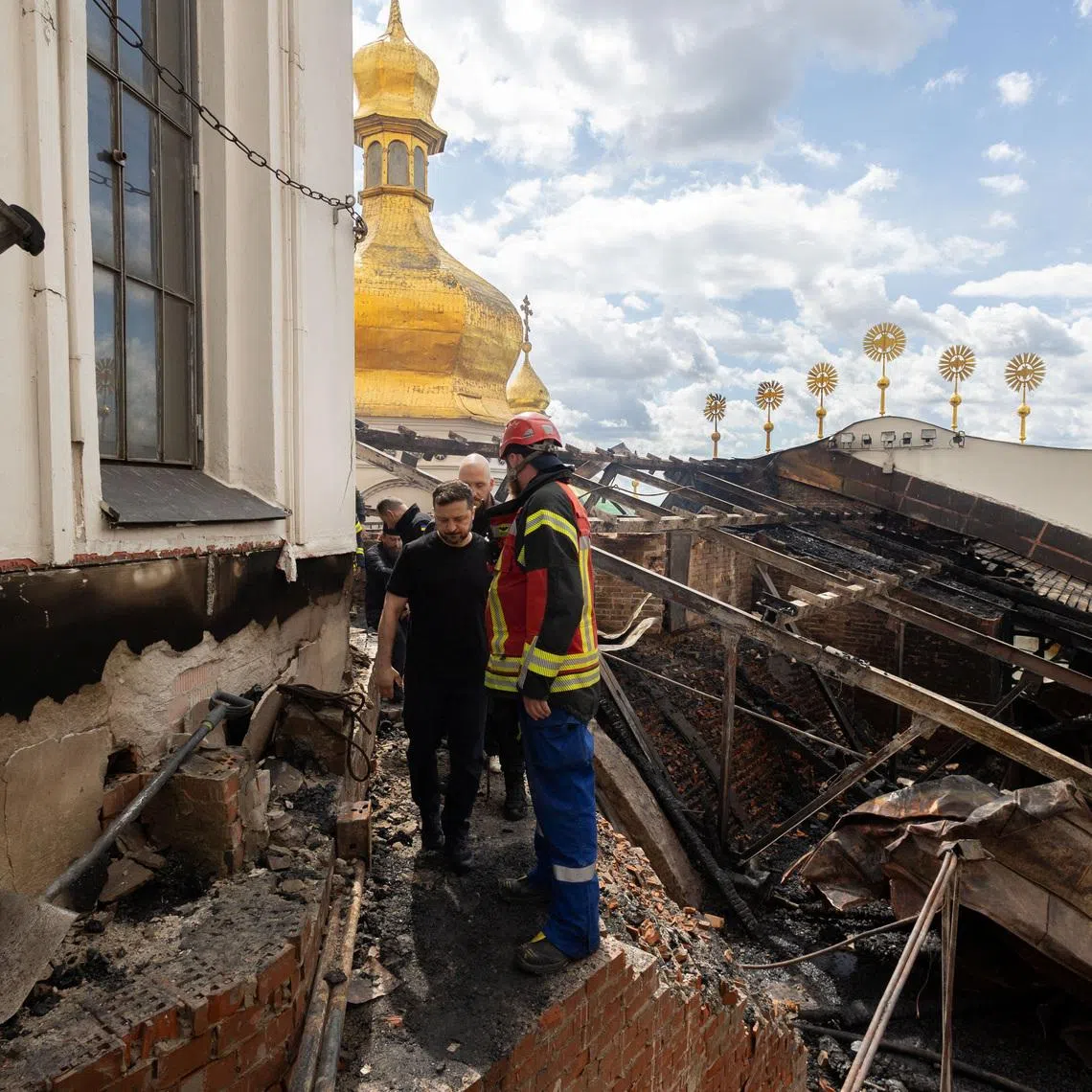 Ukraine's President Volodymyr Zelenskiy visits the Dormition Cathedral of the Kyiv Pechersk Lavra, which was hit during Russian missile and drone strikes, amid Russia's attack on Ukraine, in Kyiv, Ukraine June 15, 2026. Ukrainian Presidential Press Service/Handout via REUTERS