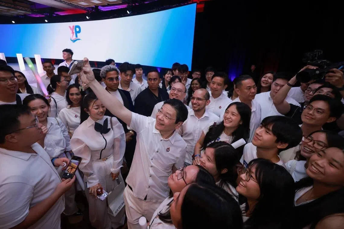 PM Lawrence Wong posing for a wefie at the Young PAP 40th Anniversary Conference on July 4.