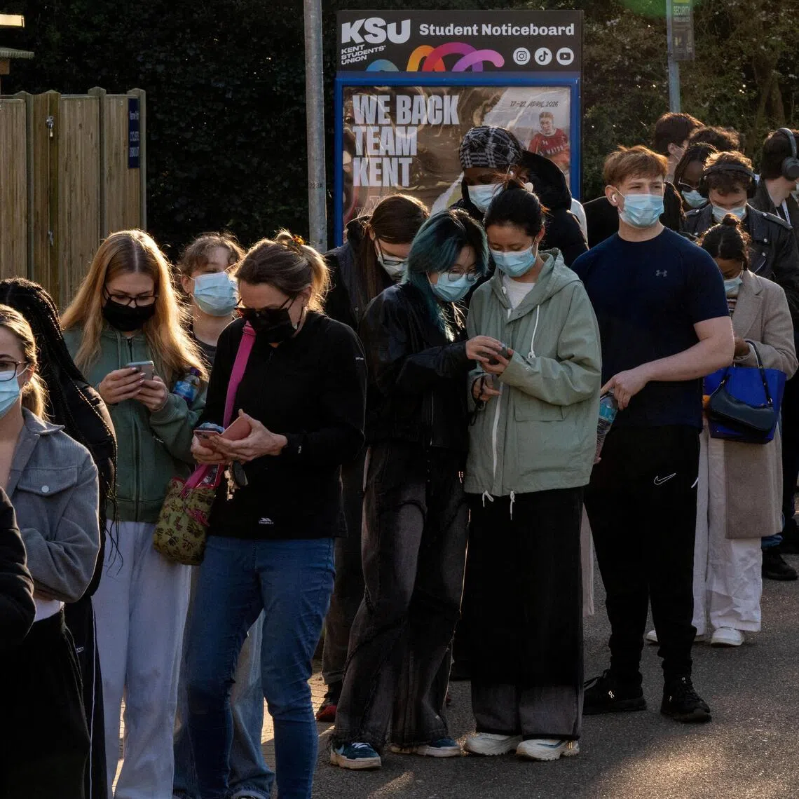 People queueing at the University of Kent in Canterbury, Britain, on March 18, following an outbreak of meningitis cases at the school.
