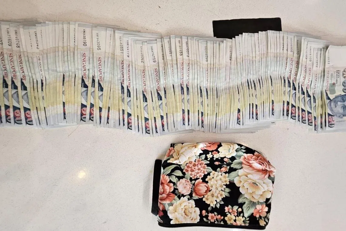 Cash seized at Eunos Crescent during the operation.


