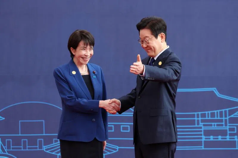 Japanese Prime Minister Sanae Takaichi is greeted by South Korea’s President Lee Jae Myung during the Asia-Pacific Economic Cooperation (APEC) summit in Gyeongju, South Korea, October 31, 2025. Yonhap via REUTERS THIS IMAGE HAS BEEN SUPPLIED BY A THIRD PARTY. NO RESALES. NO ARCHIVES. SOUTH KOREA OUT. NO COMMERCIAL OR EDITORIAL SALES IN SOUTH KOREA.