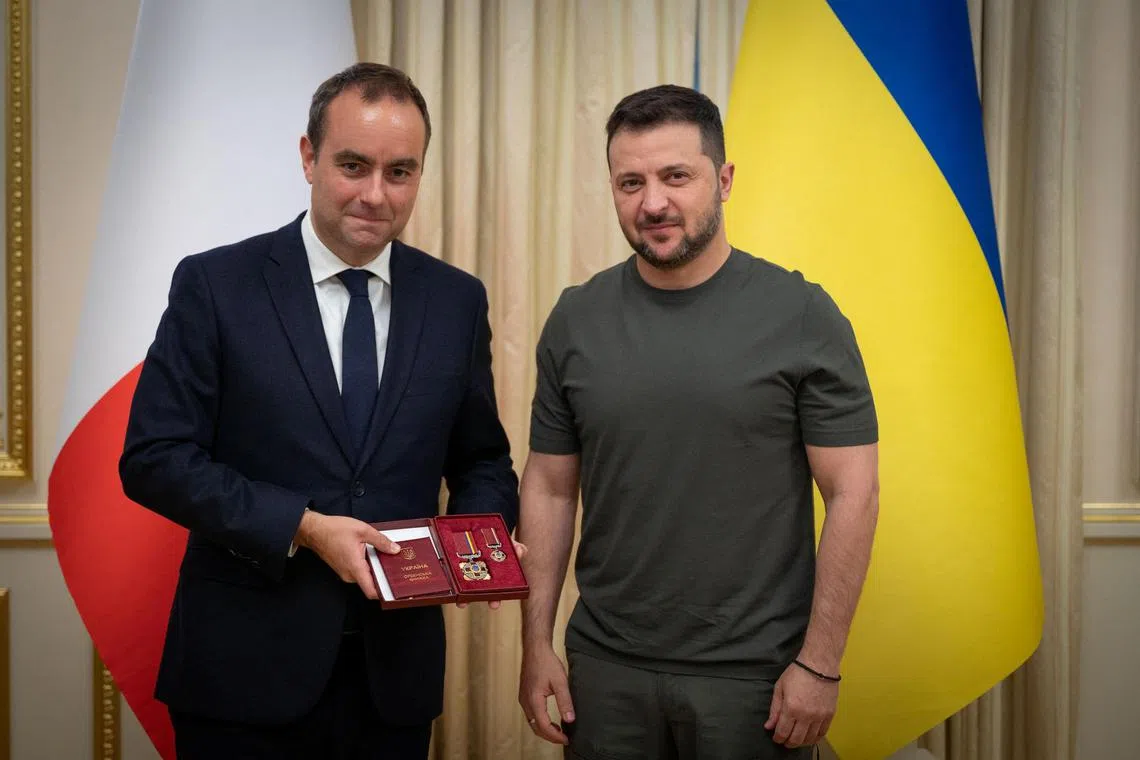 Mr Lecornu (left) was awarded with Ukraine's Order of Merit medal, by Mr Zelensky, during his visit to Kyiv.