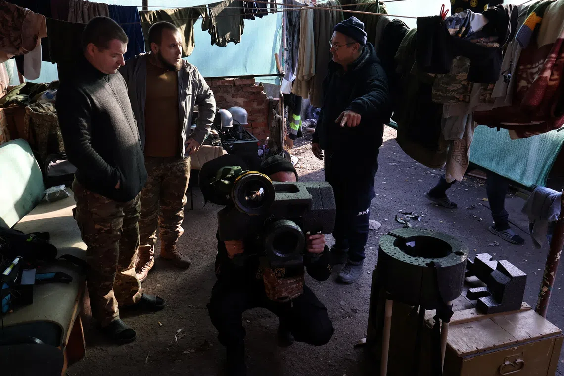 Servicemen of the 65th Separate Mechanized Brigade of the Ukrainian Armed Forces explore a Javelin missile system near a front line, amid Russia's attack on Ukraine, in Zaporizhzhia region, Ukraine November 15, 2025. Andriy Andriyenko/Press Service of the 65th Separate Mechanized Brigade of the Ukrainian Armed Forces/Handout via REUTERS