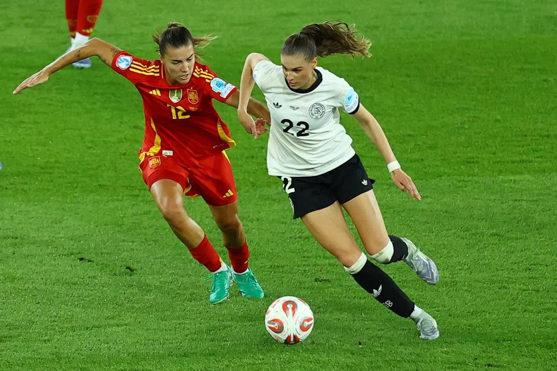 FILE PHOTO: Soccer Football - UEFA Women's Euro 2025 - Semi Final - Germany v Spain - Stadion Letzigrund, Zurich, Switzerland - July 23, 2025 Germany's Jule Brand in action with Spain's Patri Guijarro REUTERS/Piroschka Van De Wouw/File Photo