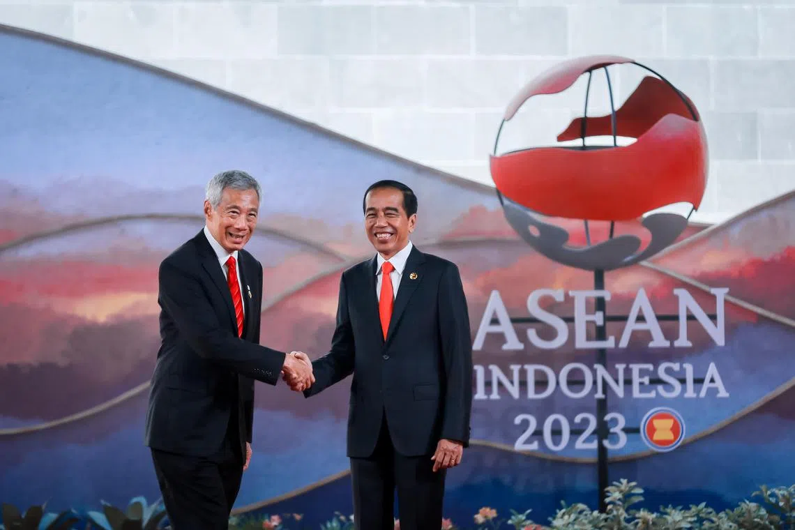 Prime Minister Lee Hsien Loong being greeted by Indonesia's President Joko Widodo as he arrives to the 42nd Association of Southeast Asian Nations (ASEAN) Summit held at the Meruorah Convention Center in Labuan Bajo, Indonesia, May 10, 2023.
