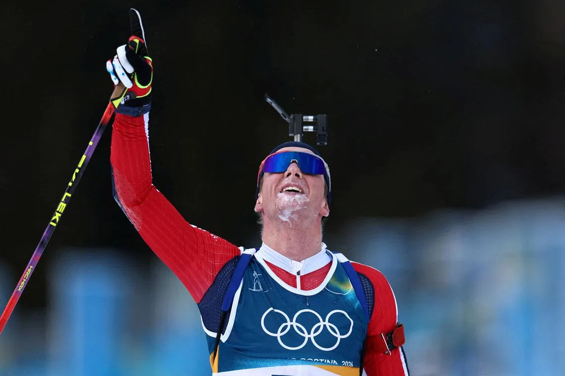 Johan-Olav Botn of Norway celebrates winning gold in the men's 20km individual biathlon.  REUTERS/Eloisa Lopez