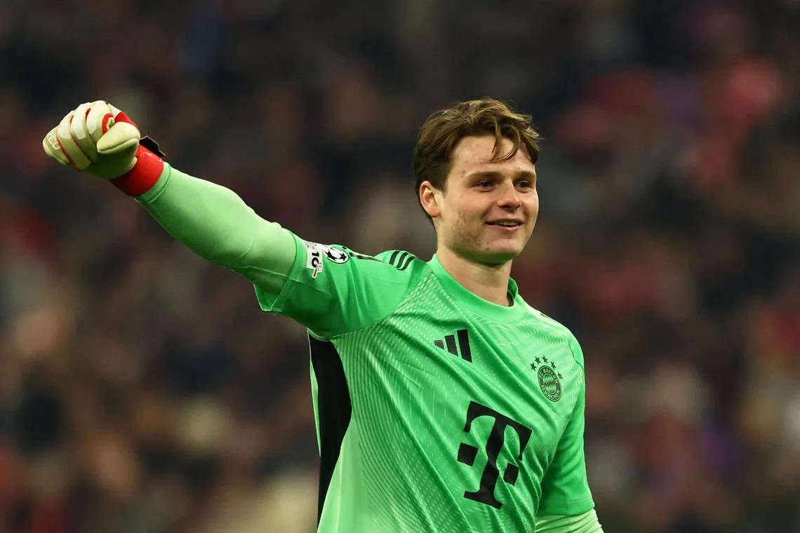 Soccer Football - UEFA Champions League - Round of 16 - Second Leg - Bayern Munich v Atalanta - Allianz Arena, Munich, Germany - March 18, 2026 Bayern Munich's Jonas Urbig celebrates after Lennart Karl scores their third goal REUTERS/Kai Pfaffenbach