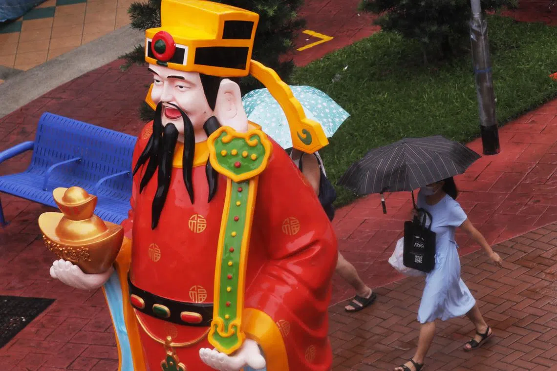 Rain dampened Chinese New Year plans for many people, with prices soaring on ride-hailing apps.