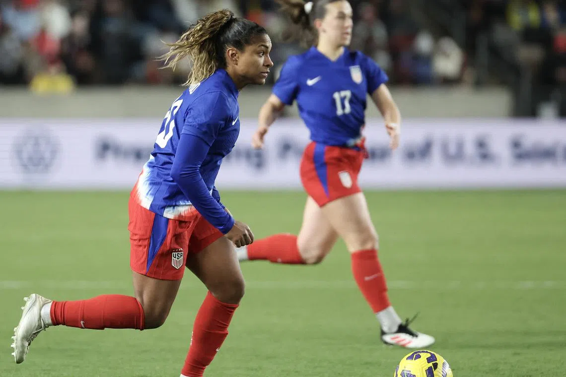 Feb 20, 2025; Houston, Texas, [USA];  USA forward Catarina Macario (20) dribbles against  Colombia in the second half at Shell Energy Stadium. Mandatory Credit: Thomas Shea-Imagn Images