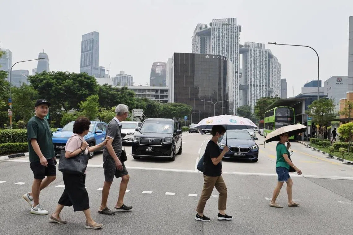 Pedestrians near Outram Park MRT station at about 12.30pm on Oct 19.