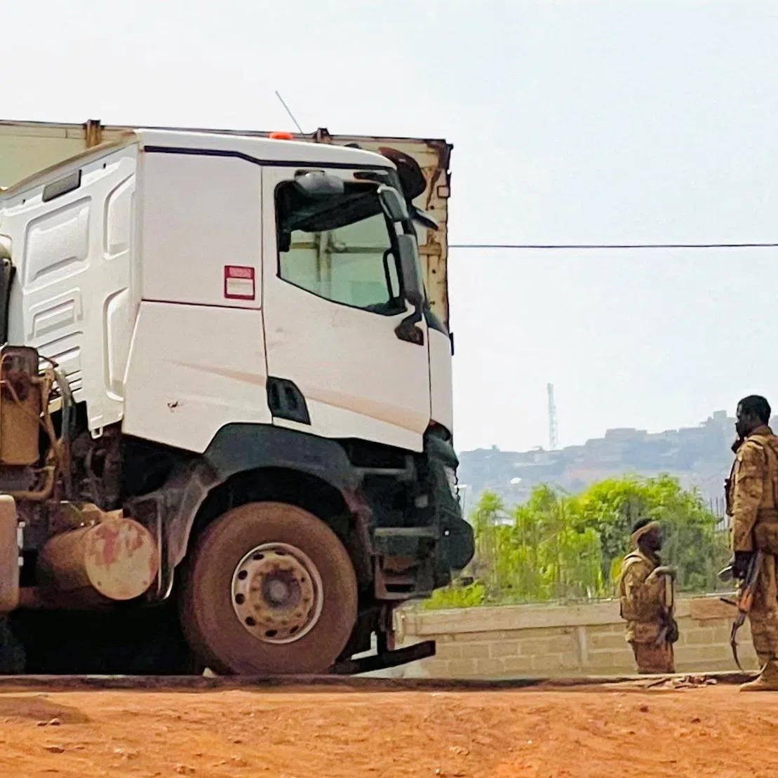 Malian soldiers stand near a truck during a patrol following the attack on Mali's main military base Kati, outside the capital Bamako, in Kati, Mali, April 27, 2026. Picture taken with a mobile phone.   REUTERS/Stringer