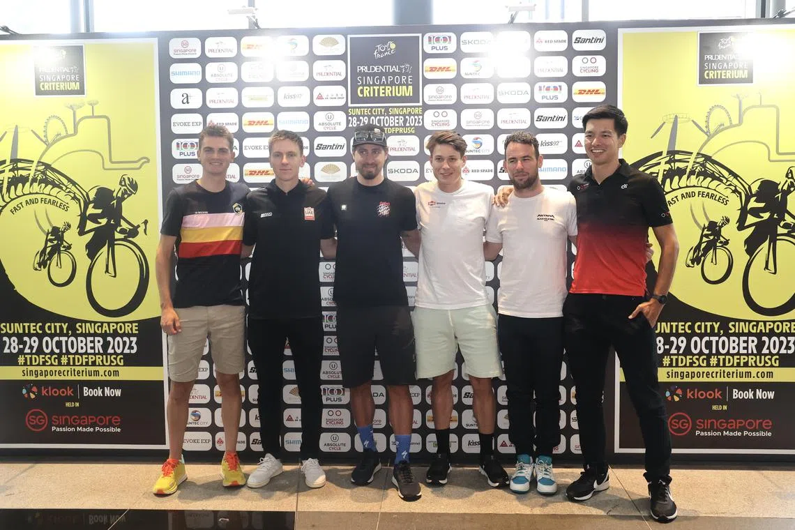 CMG20231028-WooFL02 /Tour de France Prudential Singapore Criterium Press Conference and Tour de France Prudential Singapore Criterium Riders Team Presentation [Suntec City Concourse Level 3] - (from left to right) Sepp Kuss, Tadej Pogacar, Peter Segan,  Jasper Philippsen, Mark Cavendish , Yeo Boon Kiak (please check the name with position)