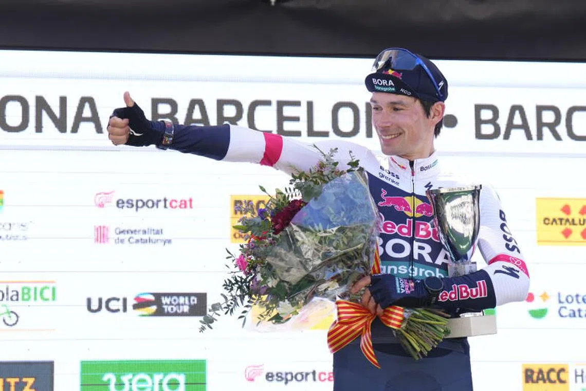 epa11999286 Slovenian rider Primoz Roglic of Red Bull Bora - hansgrohe team celebrates on the podium after winning the seventh and last stage of the Volta Ciclista a Catalunya cycling race, over 88.2km in Barcelona, Spain, 30 March 2025. EPA-EFE/Siu Wu