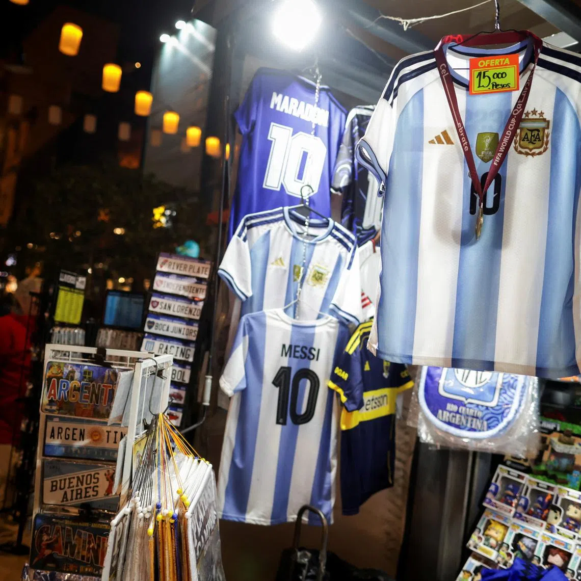 Argentina national soccer team unauthorised replica jerseys are displayed for sale at a newsstand, as World Cup fever in Argentina boosts sales of fake merchandise while inflation and sluggish economic activity make it harder for fans to buy original goods, in Buenos Aires, Argentina, May 22, 2026. REUTERS/Francisco Loureiro