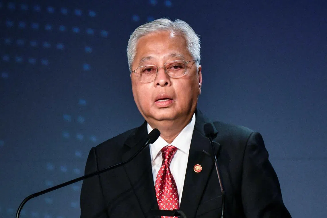 (FILES) In this file photo taken on May 26, 2022 Malaysia's Prime Minister Ismail Sabri Yaakob delivers a speech as part the 27th International Conference on The Future of Asia in Tokyo. - Ismail, a politician with a colourless personality, became prime minister in August 2021 with a thin parliamentary majority following the resignation of his predecessor after a political crisis. (Photo by Kazuhiro NOGI / AFP)