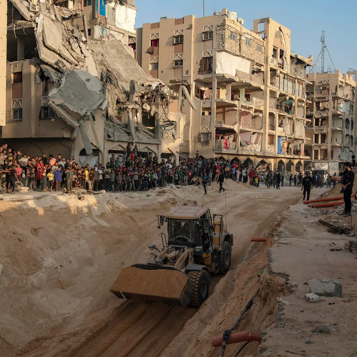 An excavator works at a site where the bodies of Israeli hostages are believed to be buried.
