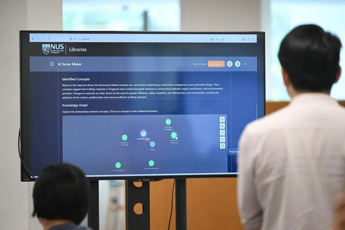 Members of the media trying out AI Sense Maker (ASM) at NUS Central Library on July 28. The new AI chat platform is designed to support academic inquiries in natural language.