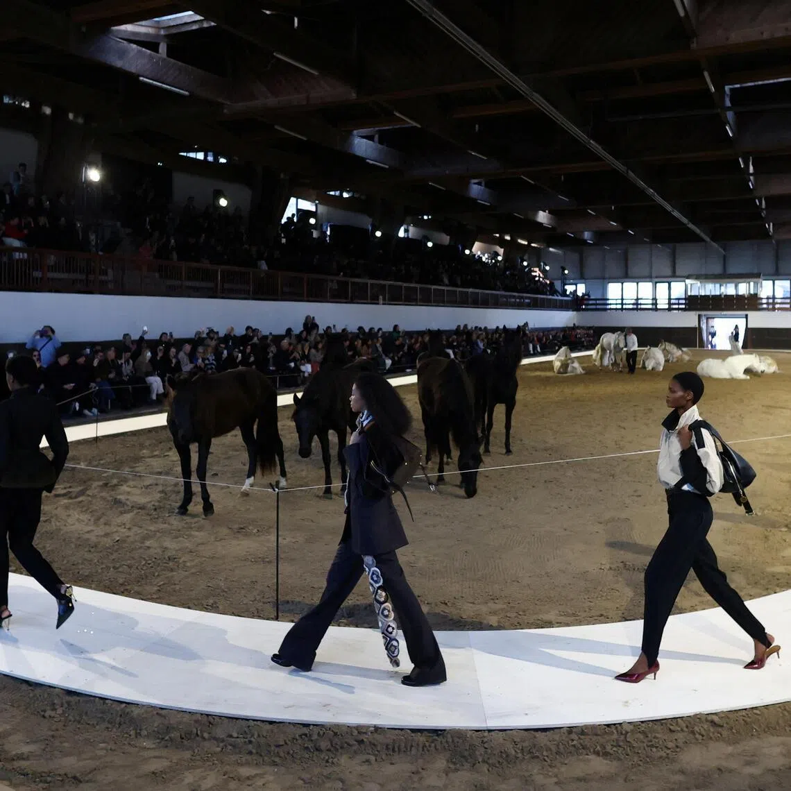 Models present creations by designer Stella McCartney as part of her Fall/Winter 2026/2027 Women's ready-to-wear collection show during Paris Fashion Week in Paris, March 4, 2026. 
