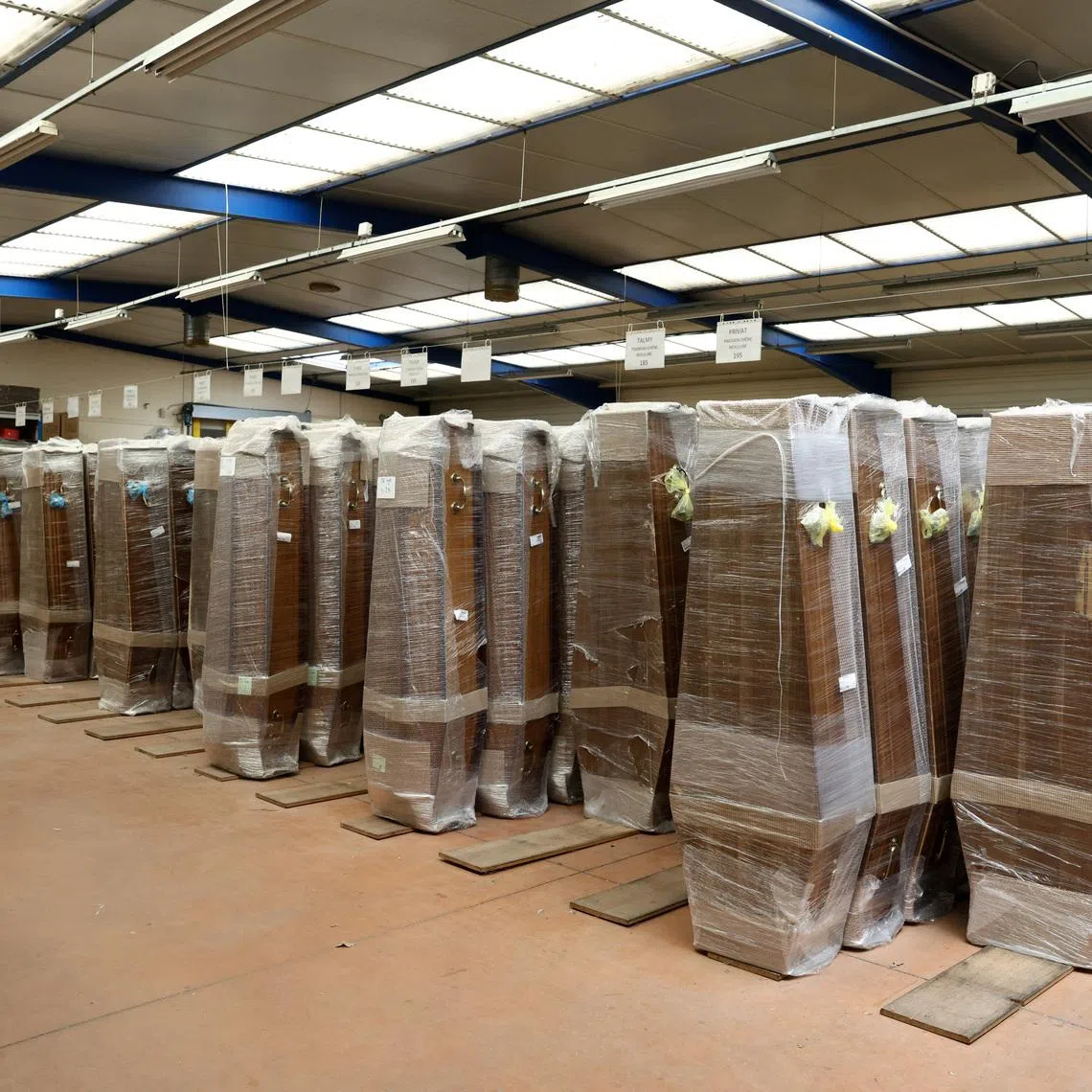 Coffins stored in a storage unit at the headquarters of Caton Funeral Directors in Orleans, on July 15.