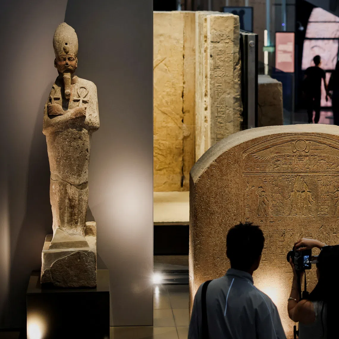 Tourists look at exhibits at the Grand Egyptian Museum (GEM), which is scheduled to officially open on November 1, 2025, following a partial opening last year, in Giza, Egypt, June 2, 2025. Egyptian officials hope the opening of the Grand Egyptian Museum will give a major boost to the tourism industry, providing an injection of foreign currency needed to keep the pound stable and ward off inflation. REUTERS/Amr Abdallah Dalsh