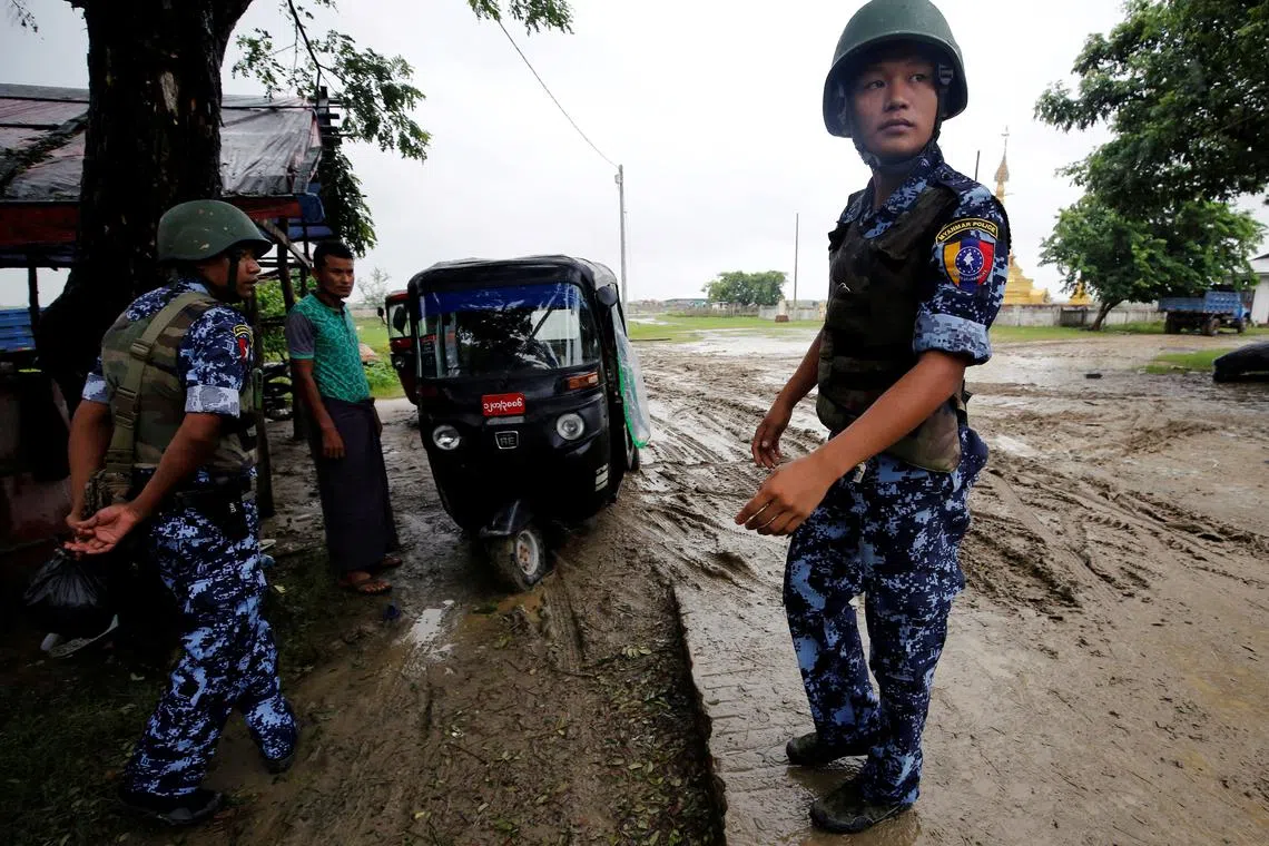 Myanmar police officer stands guard in Maungdaw, Rakhine July 9, 2019. Photo taken on July 9, 2019. REUTERS/Ann Wang/ File Photo