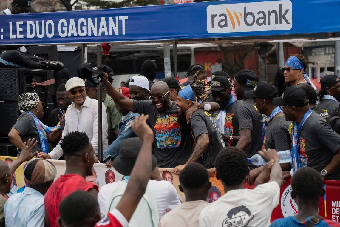 Members of the Democratic Republic of Congo national soccer team celebrate as they arrive in a bus after qualifying for the 2026 World Cup, in Kinshasa, Democratic Republic of Congo, April 5, 2026. REUTERS/ Arsene Mpiana
