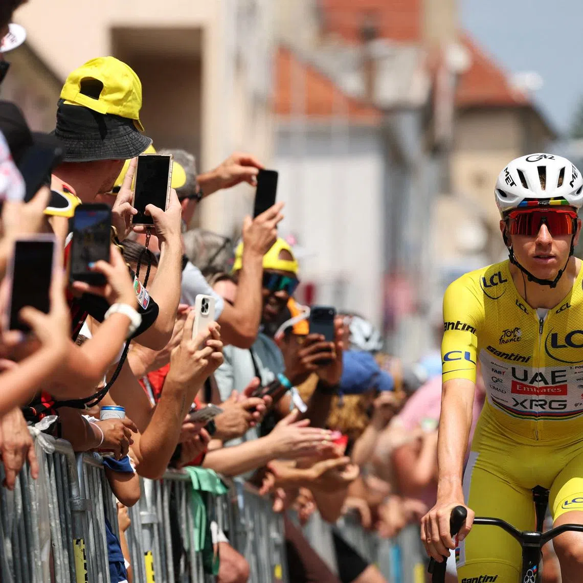 Cycling - Tour de France - Stage 15 - Champagnole to Plateau de Solaison - Champagnole, France - July 19, 2026 UAE Team Emirates - XRG's Tadej Pogacar wearing the yellow jersey before the start of stage 15 REUTERS/Gonzalo Fuentes