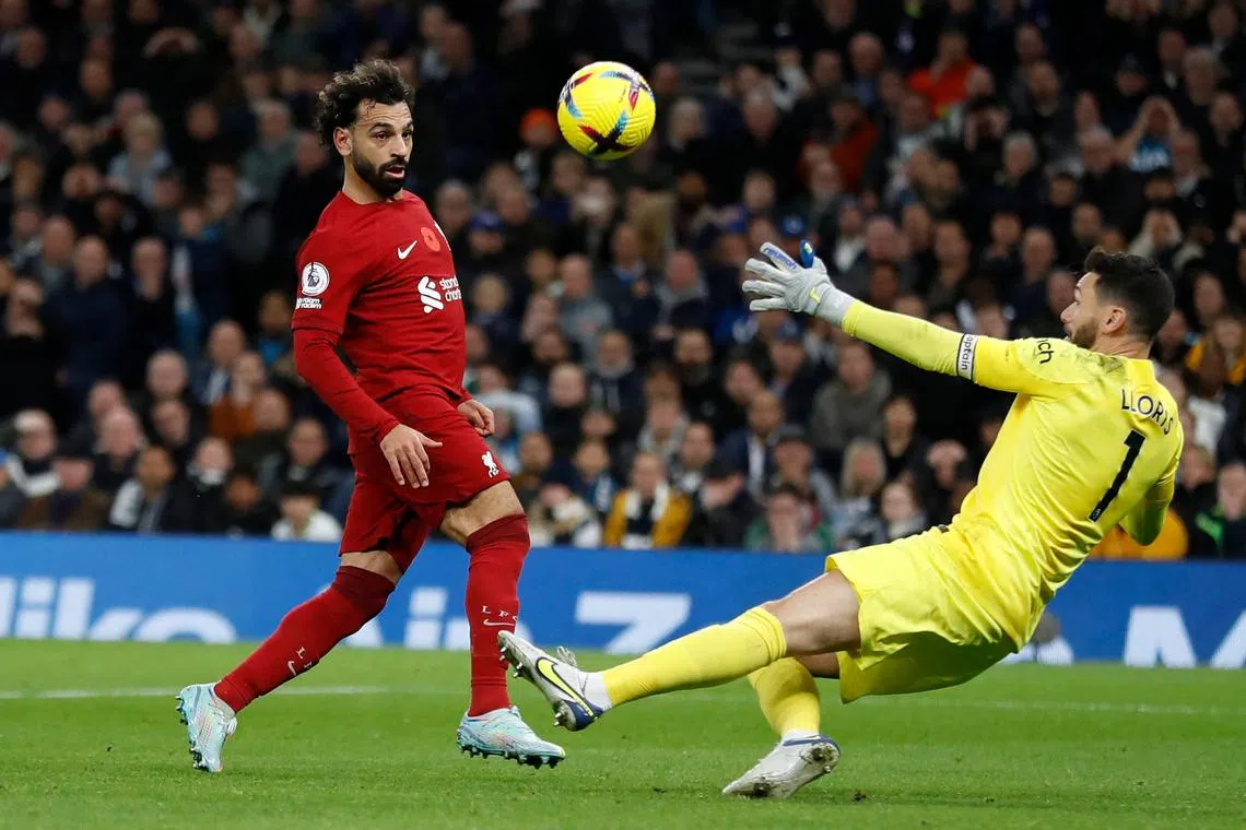  Liverpool's Egyptian striker Mohamed Salah (left) scores his team's second goal.