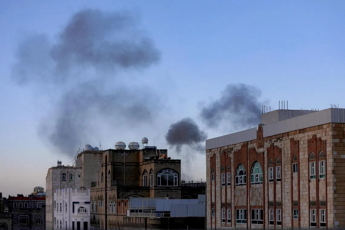 Smoke billowing in Yemen's capital, Sanaa, following explosions, on Oct 4.