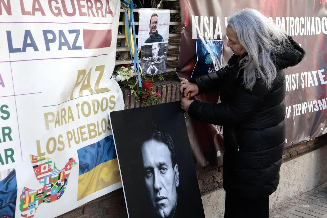 A woman pays tribute to late Russian opposition leader Alexei Navalny at his memorial near the Russian embassy in Madrid, Spain on March 3, 2024.  