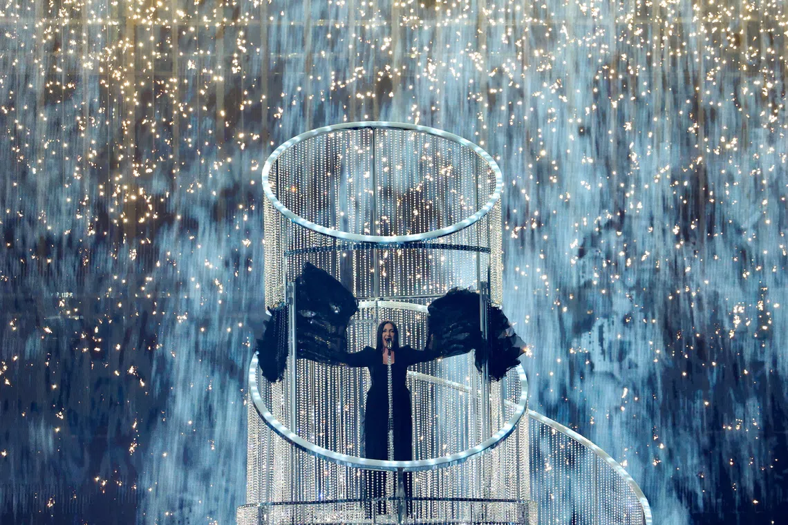 FILE PHOTO: Yuval Raphael, representing Israel, performs \"New Day Will Rise\", during the Grand Final of the 2025 Eurovision Song Contest in Basel, Switzerland, May 17, 2025. REUTERS/Denis Balibouse/File Photo