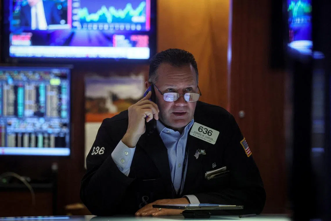 A trader works on the floor of the New York Stock Exchange (NYSE) in New York City, U.S., November 29, 2022.  REUTERS/Brendan McDermid 