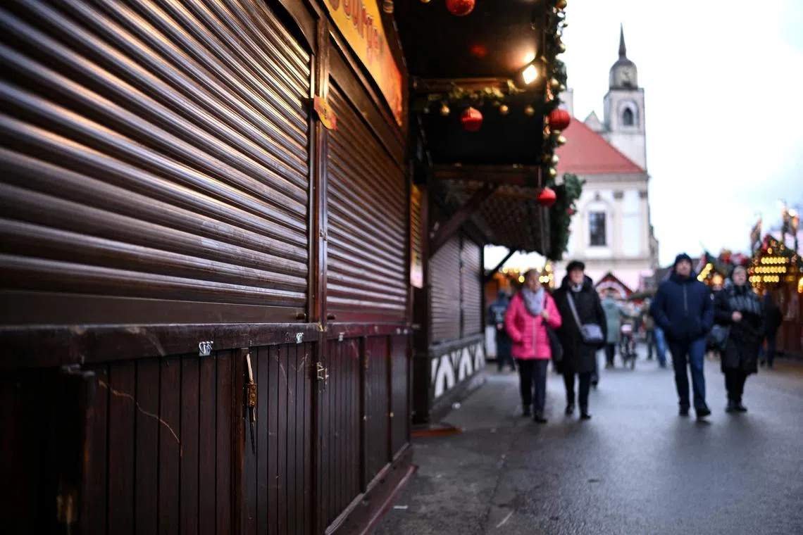 FILE PHOTO: A closed stall with signs of damage stands at the 'Alter Markt' Christmas market, where a man drove a car into the crowd through an emergency exit route on Friday evening, in Magdeburg, Germany December 22, 2024.  REUTERS/Annegret Hilse/File Photo