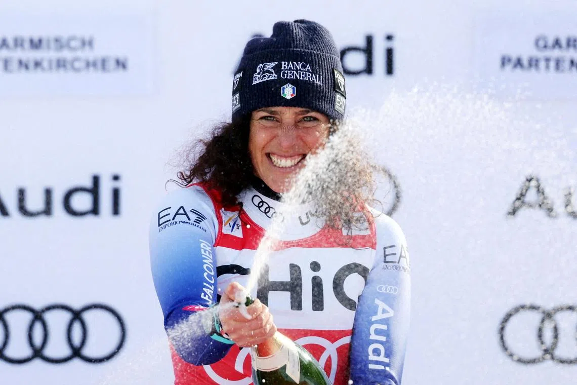 FILE PHOTO: Alpine Skiing - FIS Alpine Ski World Cup - Women's Downhill - Garmisch-Partenkirchen, Germany - January 25, 2025 Italy's Federica Brignone celebrates on the podium after winning the Women's Downhill REUTERS/Gintare Karpaviciute/File Photo