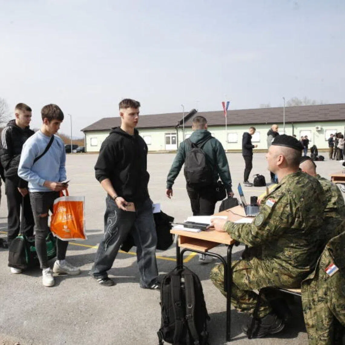 New recruits arrive at the barracks as officers check their identity to begin a basic training programme, in Slunj, Croatia, on March 9.