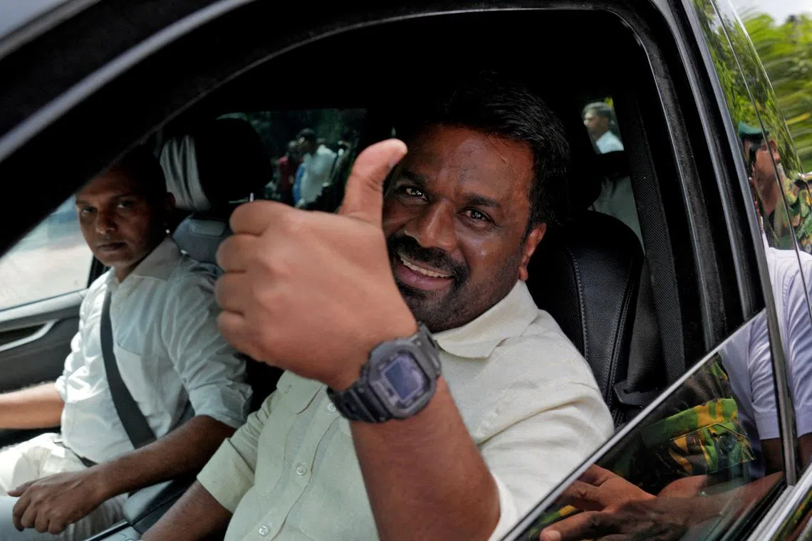 Sri Lanka's President and National People's Power party leader Anura Kumara Dissanayake gestures as he leaves after casting his vote on Nov 14.