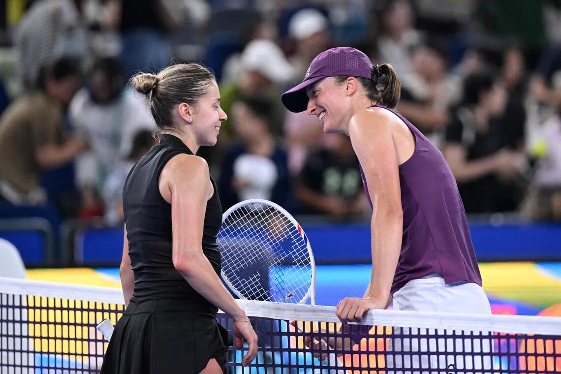 Poland’s Iga Swiatek (right) with compatriot Maja Chwalinska at the Wuhan Open on Oct 17.
