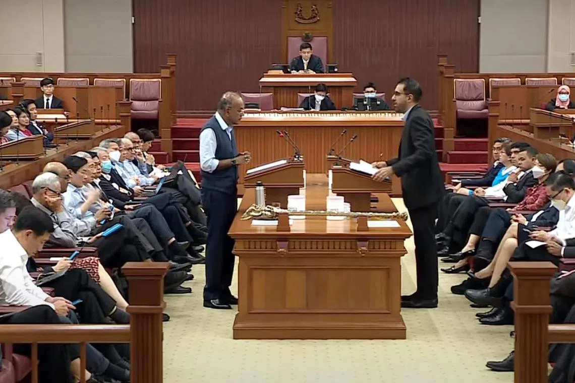 Minister for Home Affairs and Law K. Shanmugam (left) and Leader of the Opposition Pritam Singh speaking in Parliament on Nov 29, 2022.