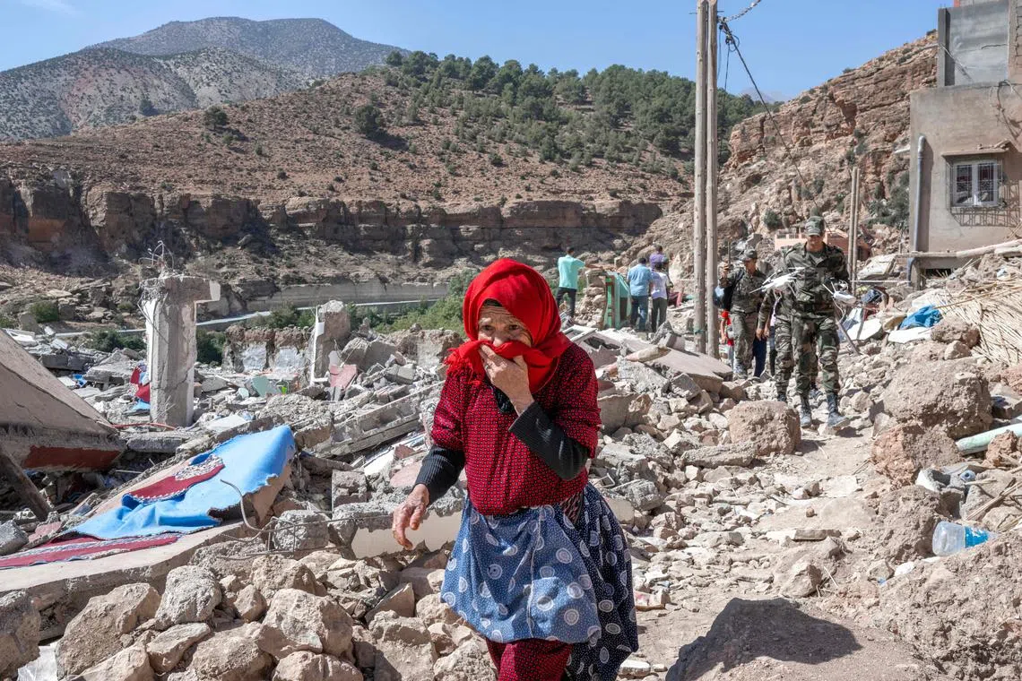 A woman walking amid debris in the earthquake-hit village of Imi N’Tala on Sept 19.