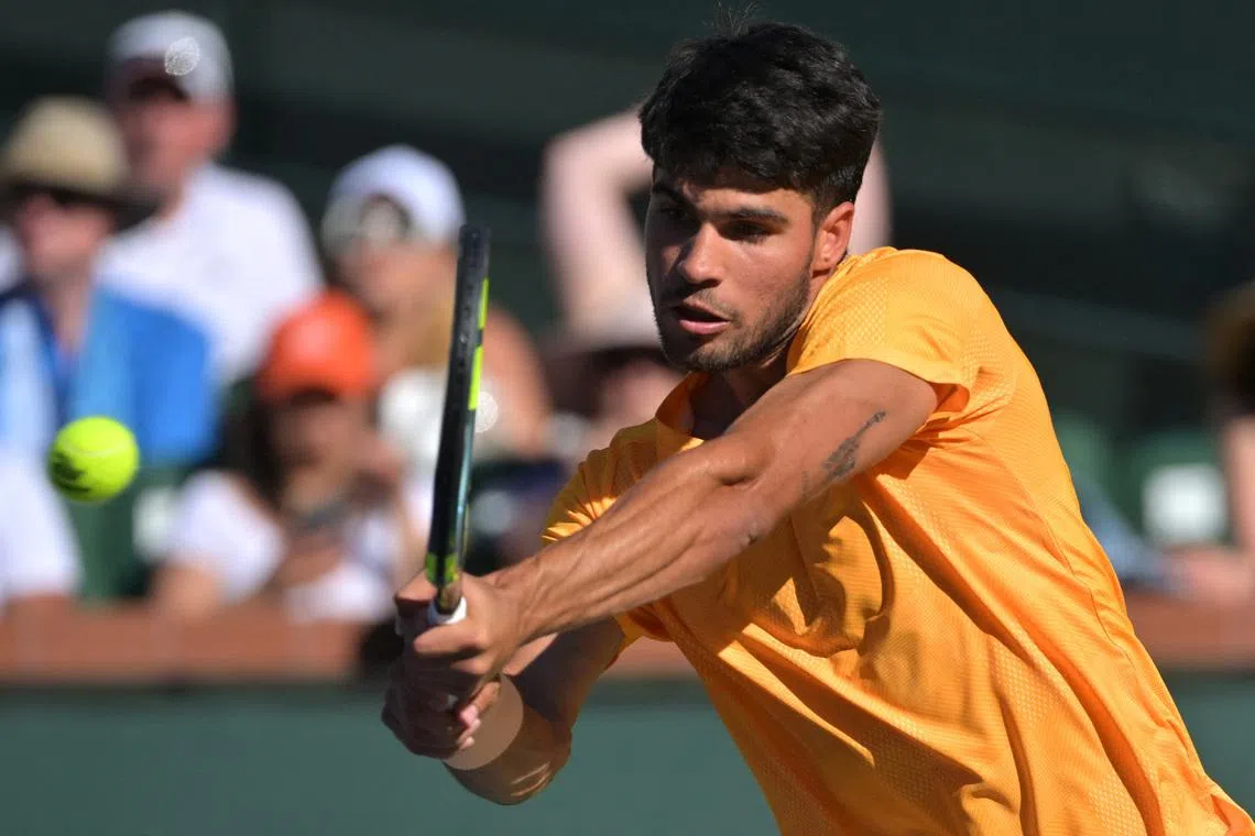 Mar 11, 2026; Indian Wells, CA, USA;  Carlos Alcaraz (ESP) hits a shot as he defeated Casper Ruud (NOR) during the fourth round in the BNP Paribas Open at the Indian Wells Tennis Garden. Mandatory Credit: Jayne Kamin-Oncea-Imagn Images