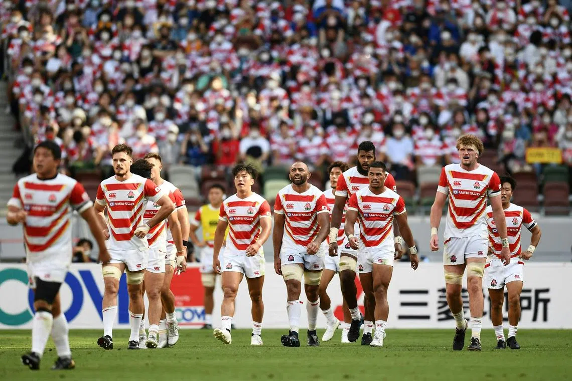(FILES) Japan's players react after scoring a try during the second rugby union international Test match between Japan and France at the National Stadium in Tokyo on July 9, 2022. Japan is capable of everything same as their performance in 2019 World Cup and its very attacking style can pose problems for England during the Rugby World Cup 2023 in France, said coach Jamie Joseph in an interview with AFP. (Photo by CHARLY TRIBALLEAU / AFP)