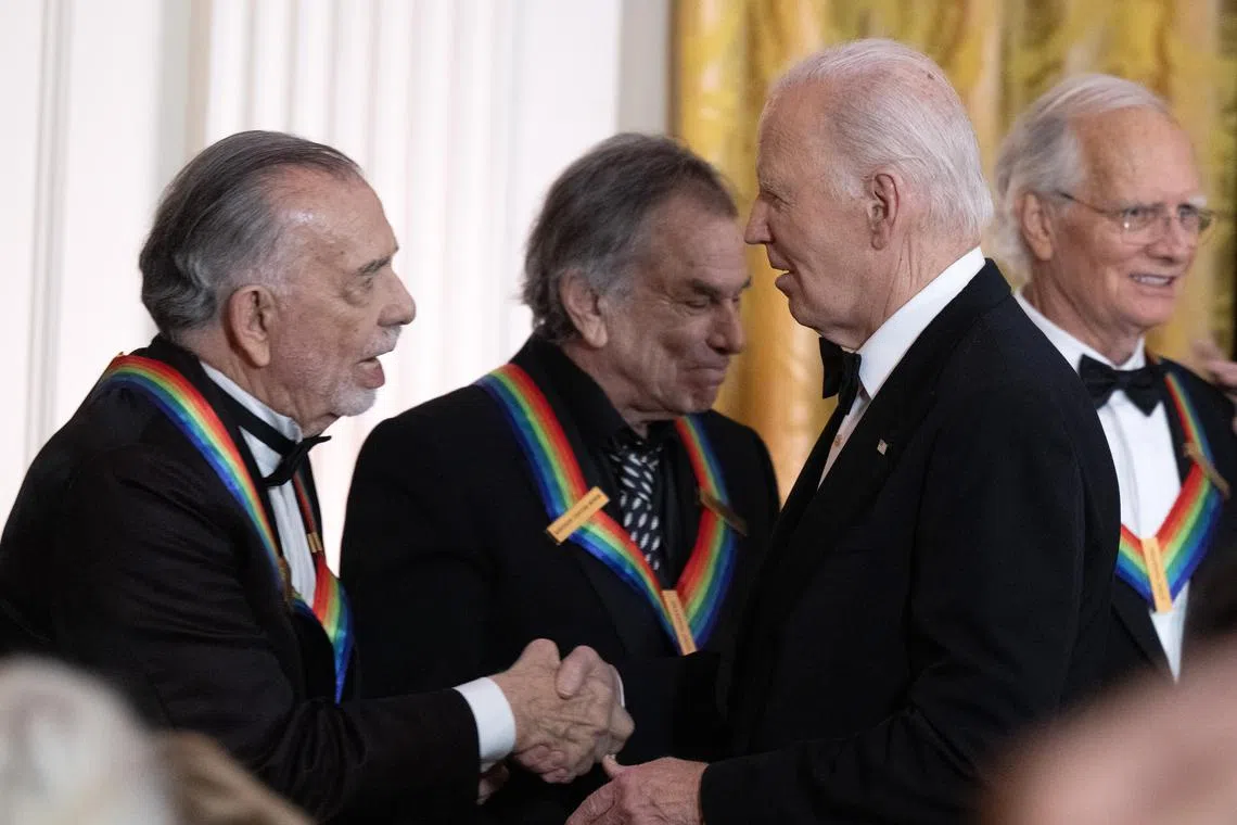Director and filmmaker Francis Ford Coppola (left) shakes hands with US President Joe Biden at the 47th Annual Kennedy Center Honorees in the East Room of the White House on Dec 8.