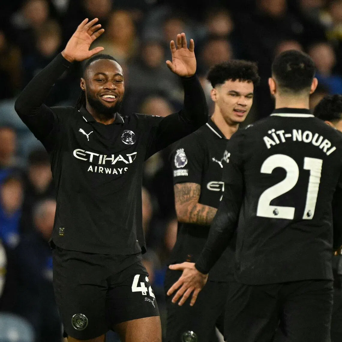 Manchester City's Antoine Semenyo (left) celebrates his halftime goal with Rayan Ait-Nouri (right).