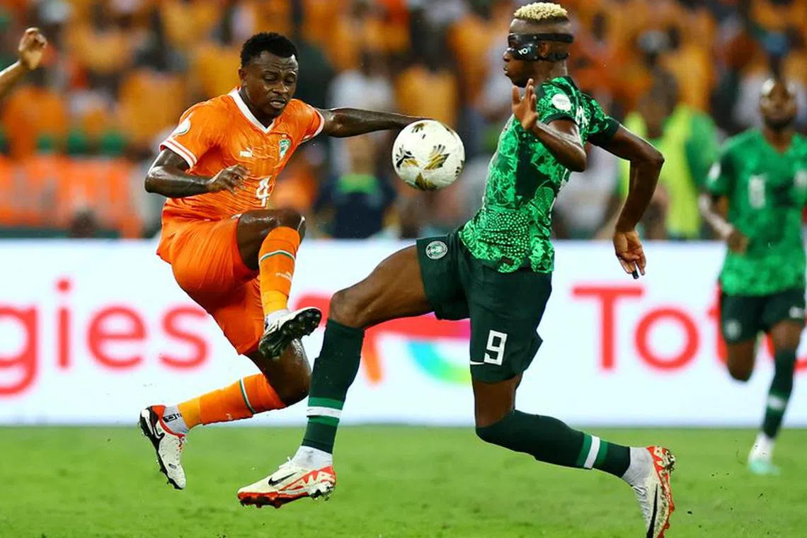 Soccer Football - Africa Cup of Nations - Final - Nigeria v Ivory Coast - Stade Olympique Alassane Ouattara, Abidjan, Ivory Coast - February 11, 2024 Nigeria's Victor Osimhen in action with Ivory Coast's Jean Michael Seri REUTERS/Siphiwe Sibeko/File Photo