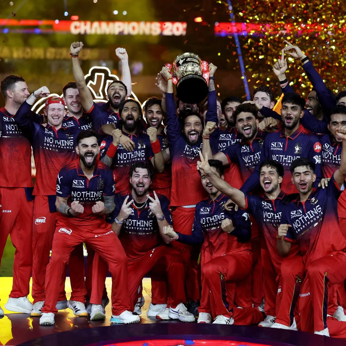 Cricket - Indian Premier League - IPL - Final - Royal Challengers Bengaluru v Gujarat Titans - Narendra Modi Stadium, Ahmedabad, India - May 31, 2026 Royal Challengers Bengaluru's Rajat Patidar lifts the trophy as he celebrates with teammates after winning the Indian Premier League REUTERS/Amit Dave